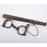 19th Century handcuffs with key and a policeman's truncheon,