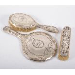 Edwardian silver backed hand mirror, Birmingham 1909, embossed and engraved decoration, 29cm,