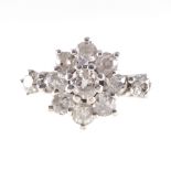 A diamond circular cluster ring, nine old brilliant cut diamonds,