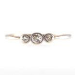 A diamond three stone ring, the old cut stones,