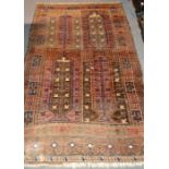 Afghan rug, the field in four panelled sections, enclosed by geometric borders, 195 x 116cm,