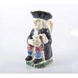 Pearlware style Toby jug Portobello type, early 19th Century, Mr Toby, seated, holding a jug of ale,