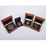 A collection of coins in presentation cases, Queen Elizabeth II 2010 Ten Pound Coin,