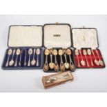 Three cased sets of silver spoons,