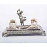 Electroplated figural desk stand, rectangular tray surmounted by a cast Spanish dancer,