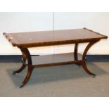 Reproduction mahogany coffee table, leather inset top, splayed legs joined by a shelf,
