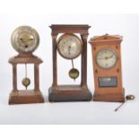 Stained beech Portico clock, 27cm; another Portico clock; and an Edwardian mantel clock.