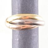 Cartier - A yellow, red and white metal trinity wedding band, plain polished finish 2.