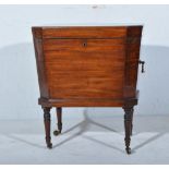Regency mahogany wine cooler, rectangular form with canted corners, twin brass handles,