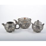Chinese stoneware and plated matched three piece teaset, the jug marked Wen Hua Shun,