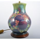 A Moorcroft Table Lamp, "Finches" design by Sally Tuffin for Moorcroft on a green ground, 27cm high,