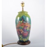 A Moorcroft Table Lamp, "Finches" design by Sally Tuffin for Moorcroft on a green ground, 22cm high,