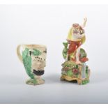 Pearlware mug, Bacchus, restored, 12cm and an earthenware figure of Neptune, restored, 21cm,