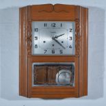 Art Deco wall clock, Vedette Carillon, oak case rectangular silver dial, H54cm x W40cm.