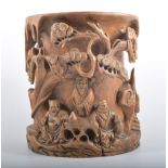 Chinese carved hard wood brush pot, the exterior carved with figures in a landscape, 22cm diameter,