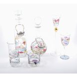 A suite art glass, comprising of decanters, stemware, pedestal bowls, and vases,