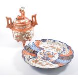 Two Imari chargers, 30cm diameter, a Kutani twin handled lidded jar with drummer boy finial, (3).