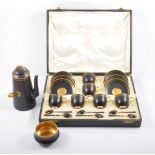 Royal Worcester black and gilt coffee set, together with a matching coffee pot and sugar bowl,