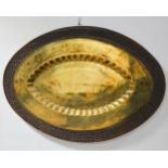 Large Indian brass and carved hardwood platter/stand, oval form,