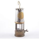 Brass and steel miner's safety lamp, labelled The Protector Lamp & Lighting Co Limited, Type GR6S,