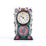 A Moorcroft mantel clock in the "Tribute to Charles Rennie Mackintosh" design by Rachel Bishop, 15.