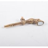 Victorian gilt metal novelty watch key in the form of a horse's foreleg inset with an onyx in the