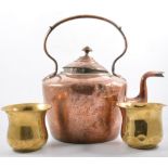 A copper coal scuttle, two copper kettles, small haystack measure, two brass owls, brass pots,