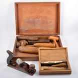 A wooden tool box, 53cm x 29cm x 30cm, containing Stanley and Record drills, various planes etc,