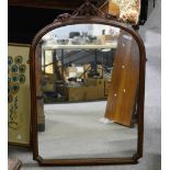 Victorian walnut framed wall mirror, carved cresting, moulded outline arched plate,
