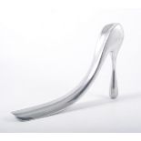 A polished aluminium Habitat shoe horn designed by Manolo Blahnik for Habitat's 40th Anniversary