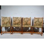 Set of four oak framed Arts and Crafts style chairs, in need of re-upholstering.