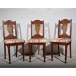 A set of six carved and painted dining chairs, loose cushion seats.