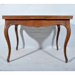 A French style 'plum pudding' mahogany extending table,