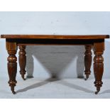 Late Victorian walnut wind-out dining table, rectangular top with moulded edge, canted corners,