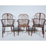 Three 19th Century yew wood and beech Windsor style armchairs.