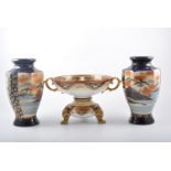 Noritake pedestal bowl, decorated with stylised birds and flowers, within panels, twin handles,