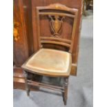 Pair of Edwardian inlaid mahogany bedroom chairs, the backs with vase shape slats,