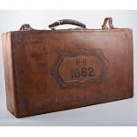 Two leather suitcases, one 56cm x 32 cm , impressed with decorative border and "PR1662", with key,