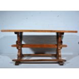 A joined oak kitchen table, rectangular boarded top, X legs joined by rails and a stretcher,