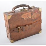 A vintage leather brass bound cartridge case,
