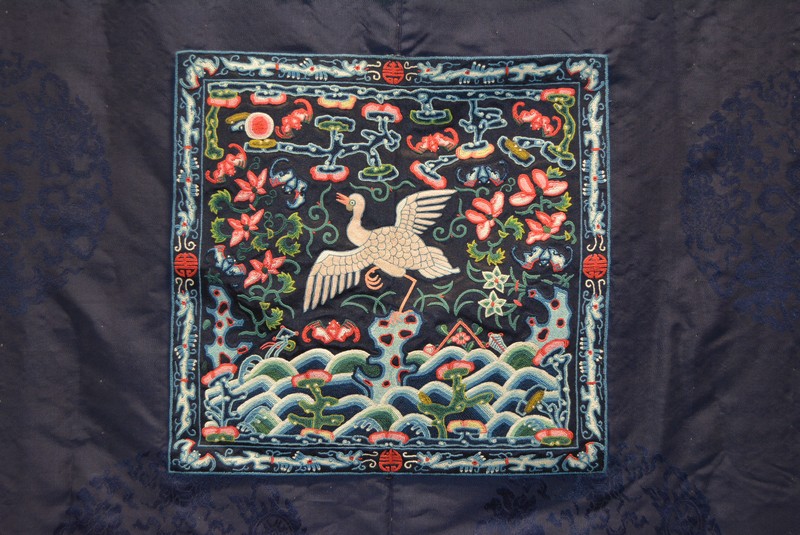 Chinese dark blue damask long robe, embroidered panels each with a mythical bird, flowers and bats, - Image 8 of 14