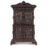 The Shakespeare cabinet Carved and stained oak cabinet,