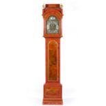 Red lacquered longcase clock, the hood with sarcophagus top, turned supports,