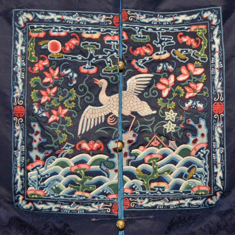 Chinese dark blue damask long robe, embroidered panels each with a mythical bird, flowers and bats, - Image 4 of 14