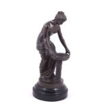 Bronze patinated spelter model of classical maiden, bird bath, on a turned socle, 32cm.