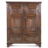 Joined oak cupboard, basically early 18th Century, ogee moulded cornice,