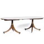 Regency style mahogany dining table, oval top with rounded corners, reeded edge,
