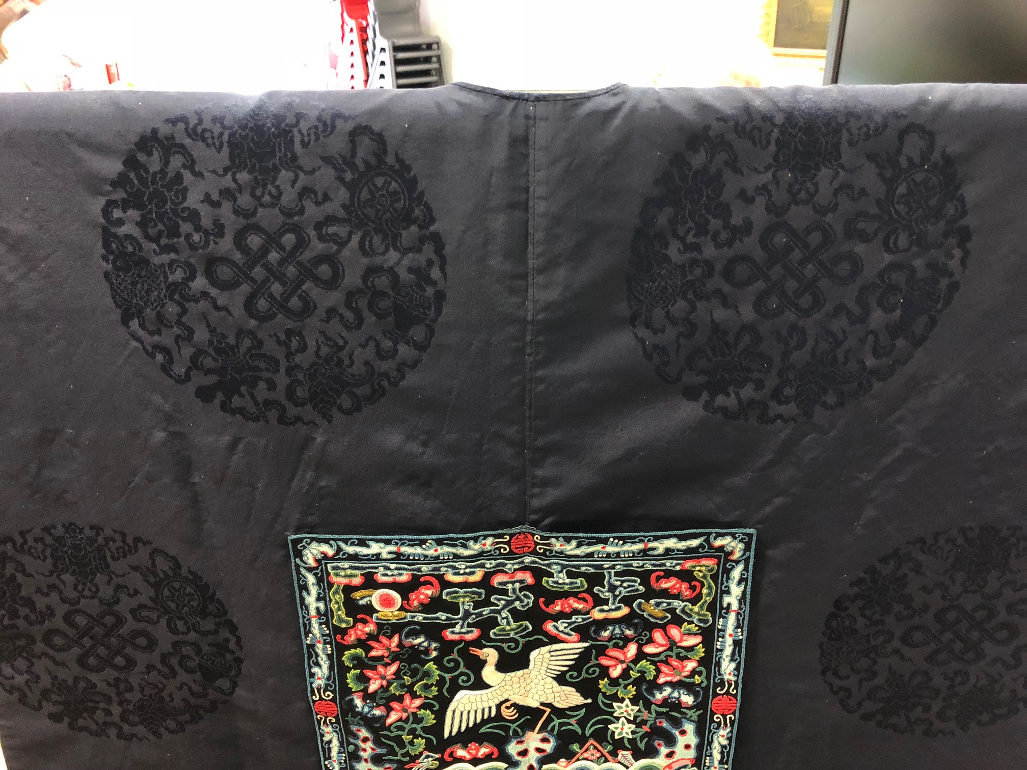 Chinese dark blue damask long robe, embroidered panels each with a mythical bird, flowers and bats, - Image 10 of 14