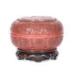 Large Chinese cinnabar lacquer bowl and cover, elaborately carved with chrysanthemum design,