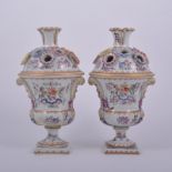 Pair of Samson porcelain urn-shaped vases, the reserves painted with armorial and stylised flowers,